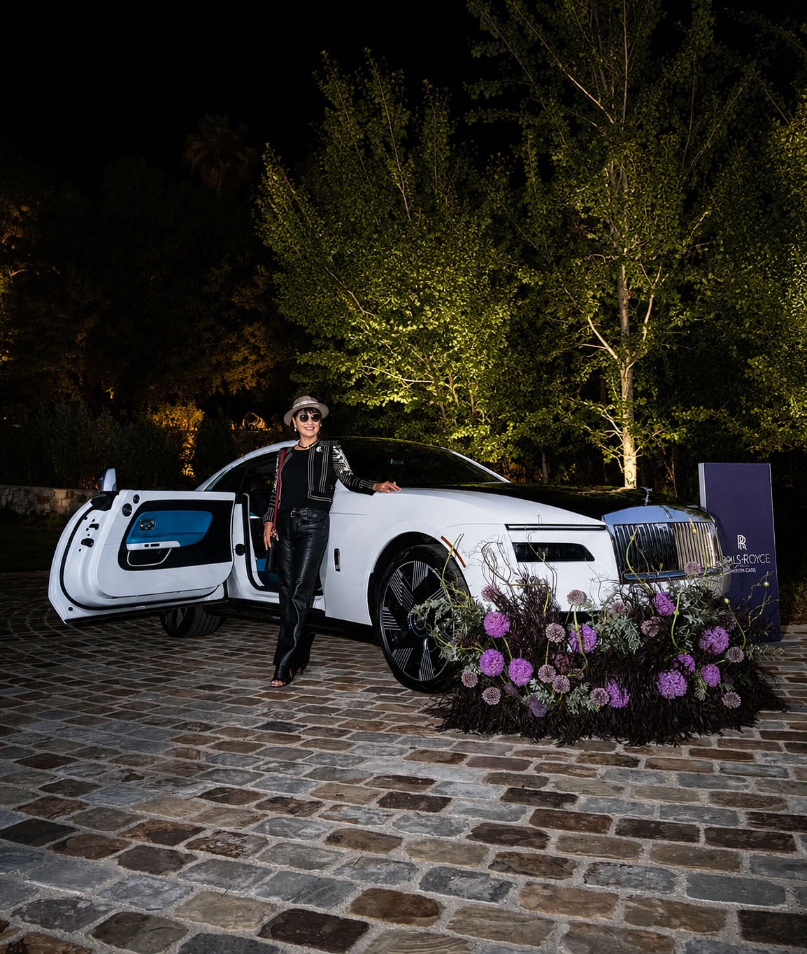 Angel Wen with a Rolls-Royce Spectre at an evening event